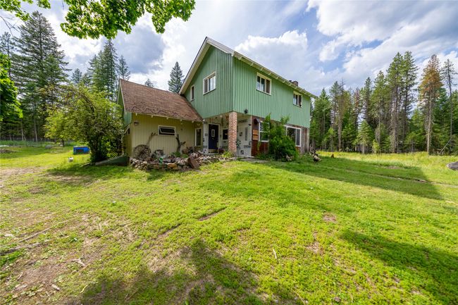Rear view of property with a yard | Image 49