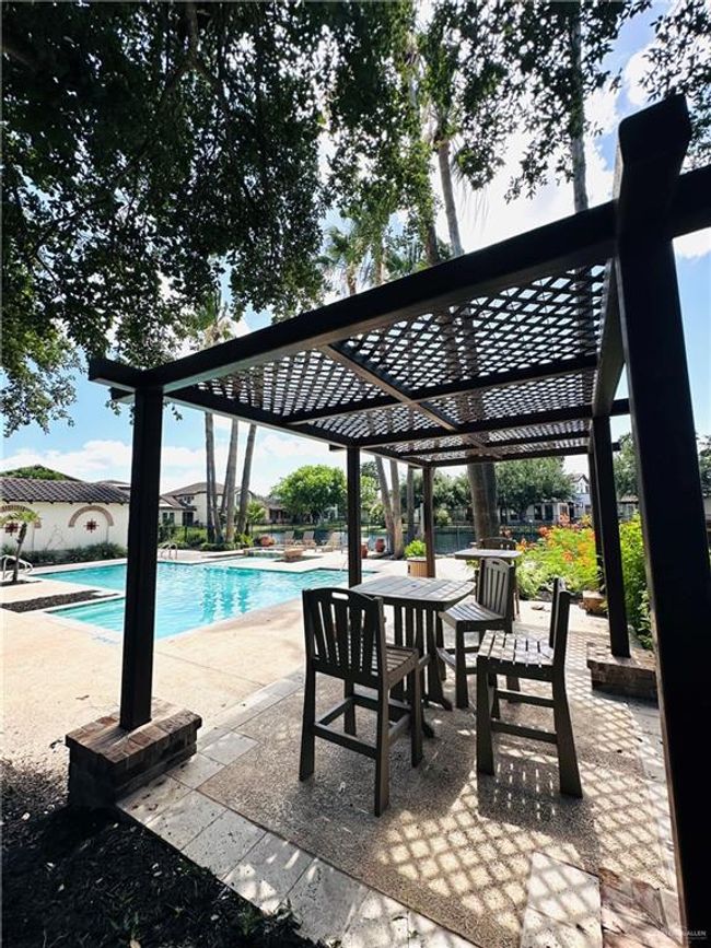 Community pool with a patio | Image 32