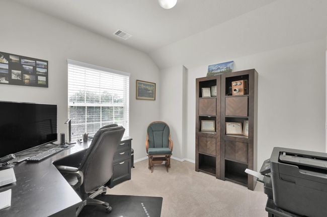 Bedroom 2 has a great view into the front of the home on your corner lot. | Image 21