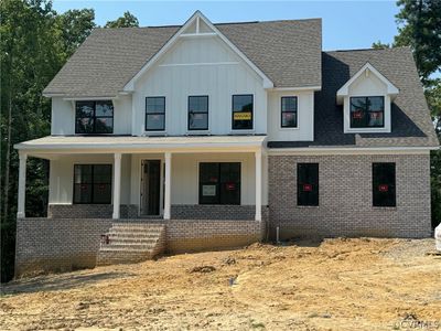 The Roanoke is a five-bedroom, four-and-a-half-bath home on a private wooded lot that backs up to a conservation area. | Image 1