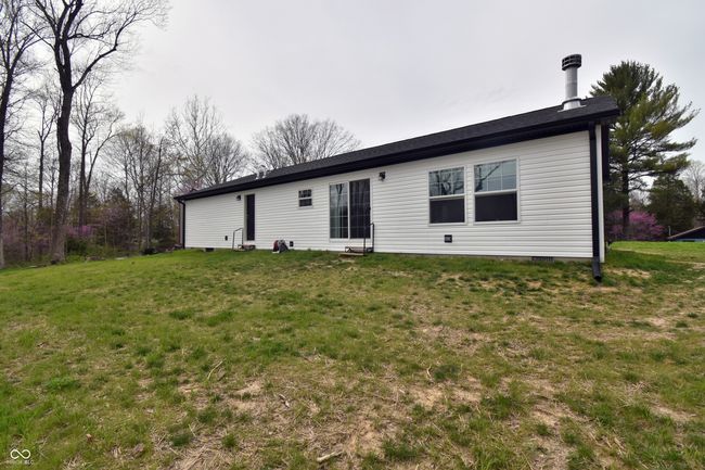 back of property with a lawn | Image 49