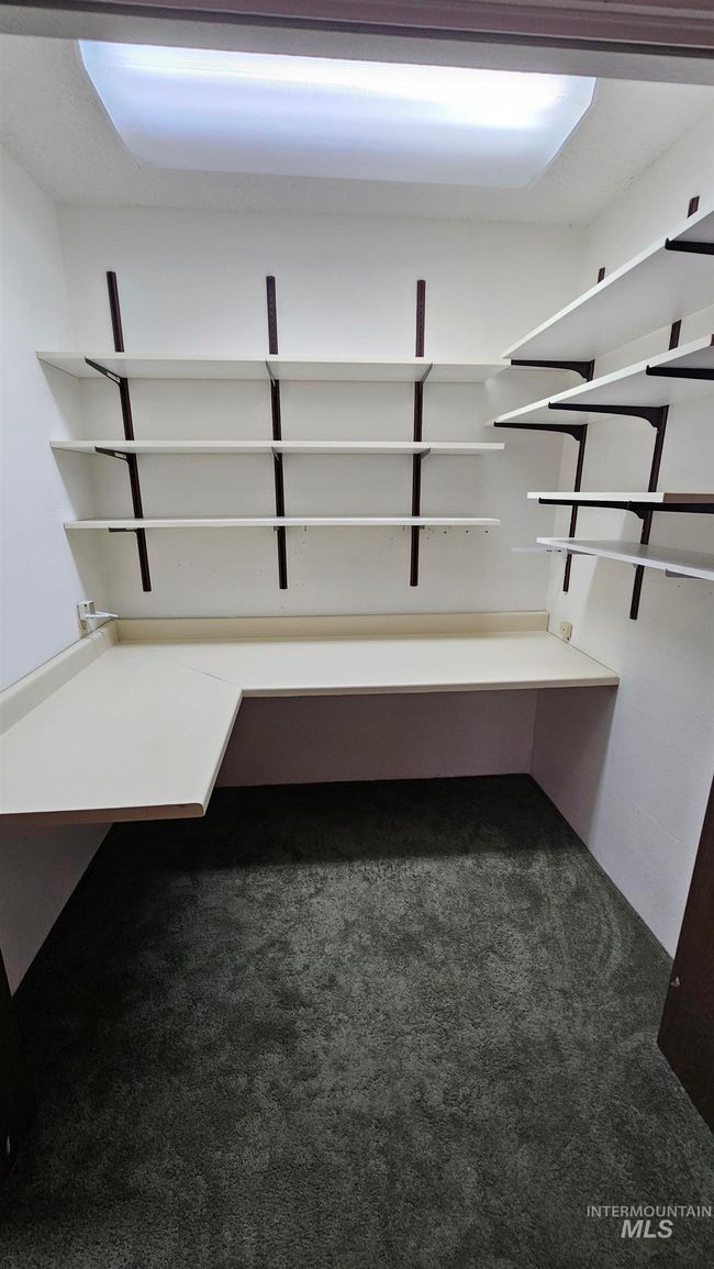 Walk in closet featuring carpet floors | Image 8