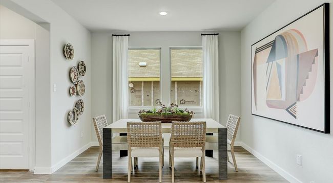 Dining space featuring light wood-style floors, baseboards, and recessed lighting | Image 10