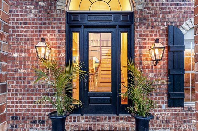 View of exterior entry featuring brick siding and french doors | Image 18