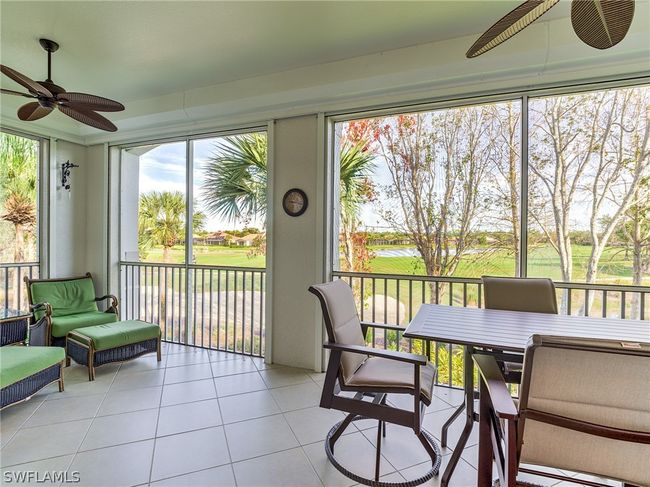 Sunroom / solarium featuring a wealth of natural light and ceiling fan | Image 36
