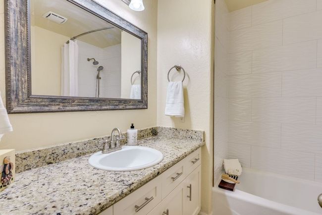 Second bathroom, granite countertop, shower/tub combination | Image 17