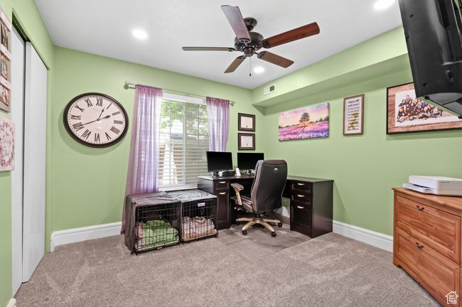 Office space with carpet flooring, a ceiling fan, and recessed lighting | Image 10