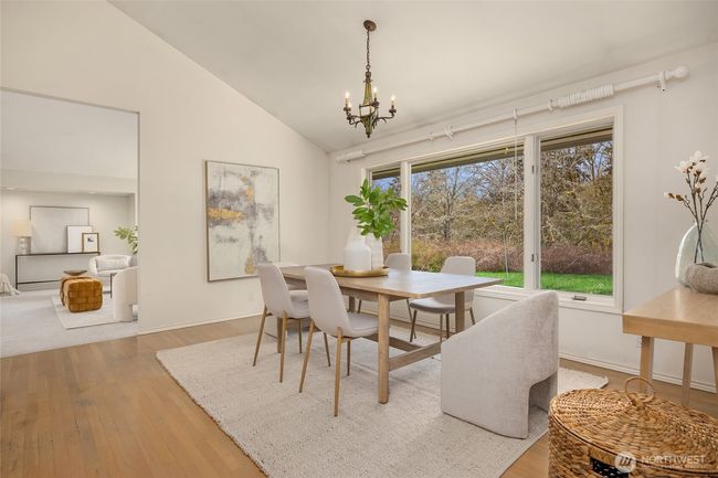 The formal dining area is spacious with vaulted ceilings and makes a wonderful place to gather with family and friends. | Image 11