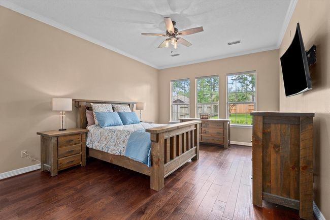 Primary suite located on first level is private and a real retreat | Image 20