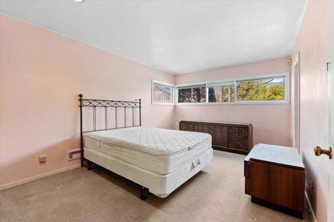 Bedroom featuring light colored carpet | Image 10
