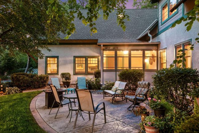 Enjoy outdoor living on the beautifully stamped concrete patio—shared yet spacious, ideal for gatherings or quiet moments. | Image 26