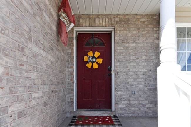 Property entrance with brick siding | Image 6