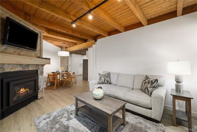 Beautiful updated living room, new floors, paint and furnishings and fireplace | Image 1