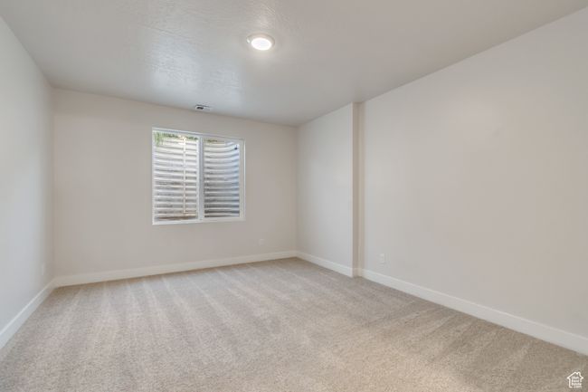 Empty room featuring light colored carpet and baseboards | Image 26