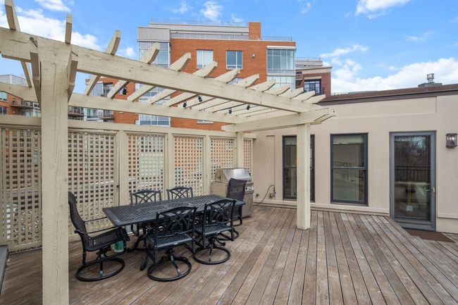 Private rooftop deck with gas fireplace & connected to the home sound system | Image 52
