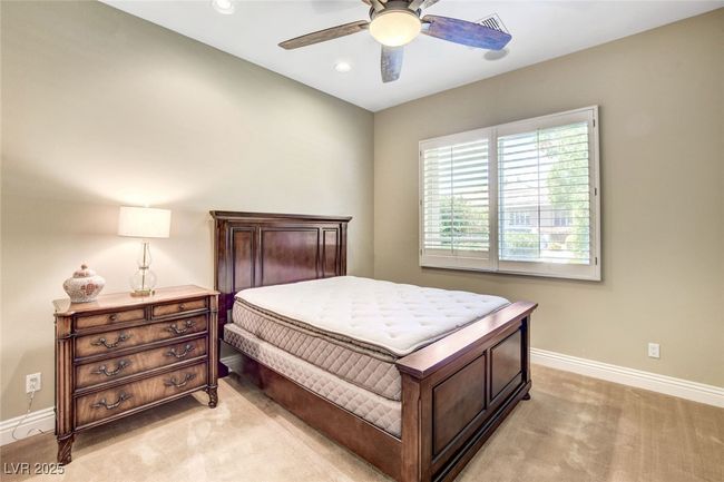 Bedroom with recessed lighting, ceiling fan, light colored carpet, and baseboards | Image 35