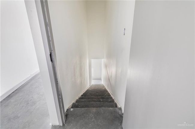 Stairway featuring concrete flooring | Image 37