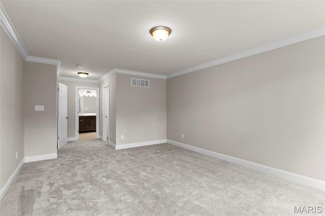 Unfurnished room featuring ornamental molding, light colored carpet, and baseboards | Image 19
