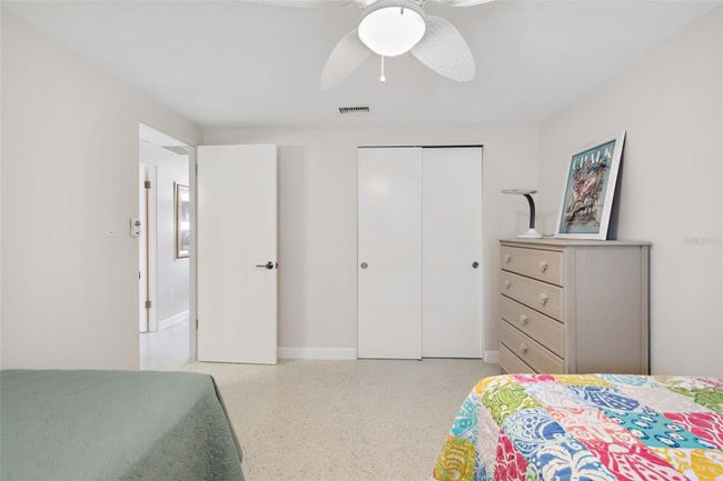 Guest bedroom has a built-in closet. | Image 20