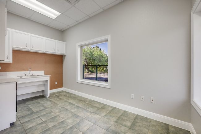 Laundry room featuring baseboards and a sink | Image 29