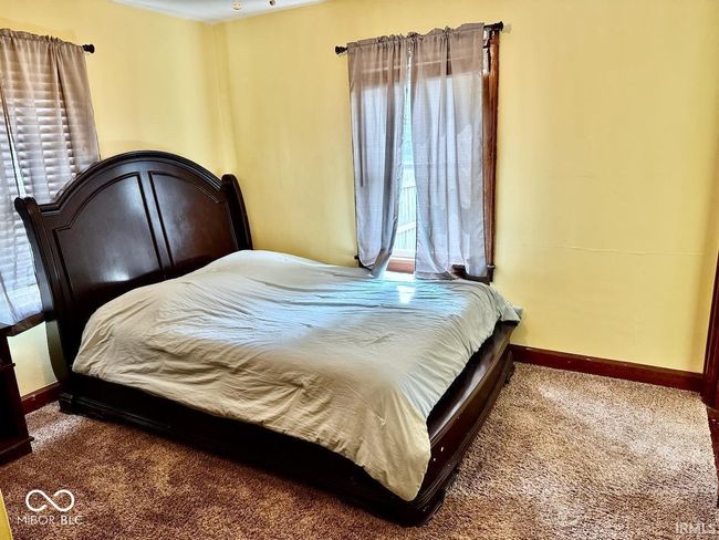 bedroom with multiple windows and carpet floors | Image 25