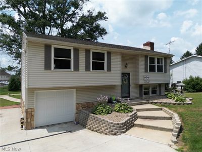 Bi-level home featuring a garage | Image 1