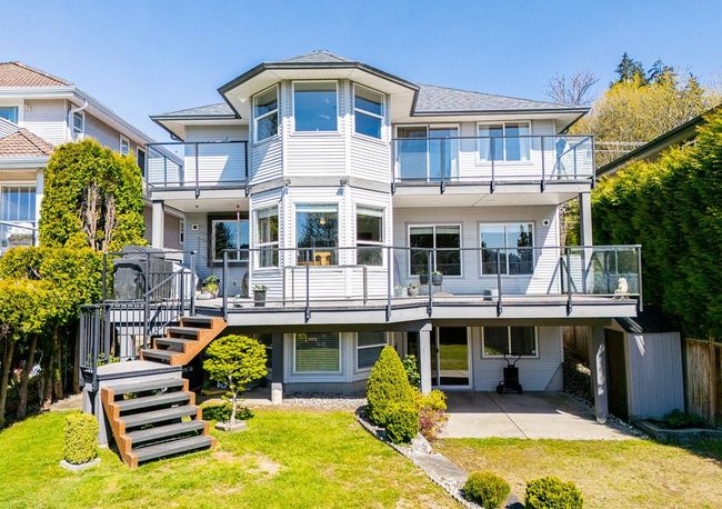Rear view of property with a balcony and a patio | Image 36