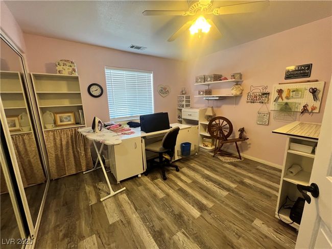 Office area featuring ceiling fan and wood finished floors | Image 50