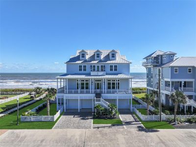 Discover unparalleled beachfront living in this custom-built haven! With sweeping ocean views from over 2, 000 square feet of covered porches, a hand-laid paved driveway, a fully upgraded landscaping package & irrigation system and unobstructed beach access, this exquisite home is the ultimate coastal retreat. | Image 2