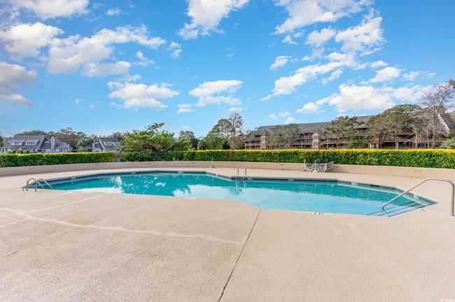 One of the many Community pools featuring a patio | Image 30