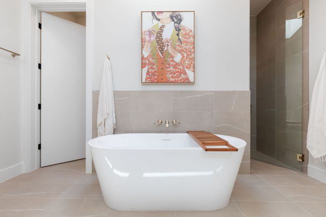 Full bath featuring tile patterned flooring, a soaking tub, and tile walls | Image 29