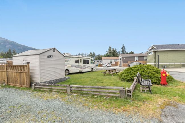 Corner lot with storage shed and grassy yard space | Image 6