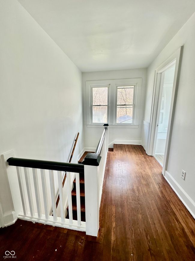spare room featuring wood finished floors and baseboards | Image 32