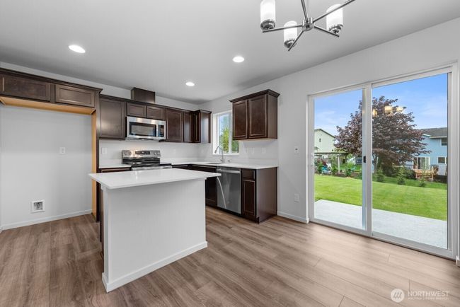 Photographs are for illustrative purposes only. Features, finishes, interior/exterior colors, landscaping and floorplan shown may vary from actual homes built. | Image 9