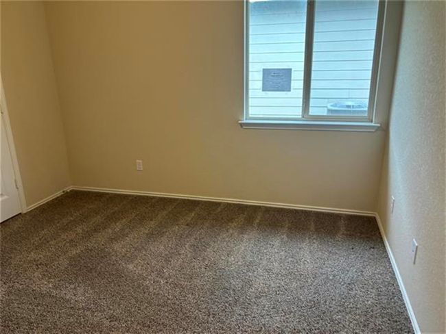 Unfurnished room with dark carpet | Image 8