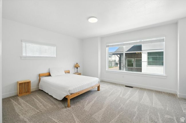Carpeted bedroom with baseboards | Image 10