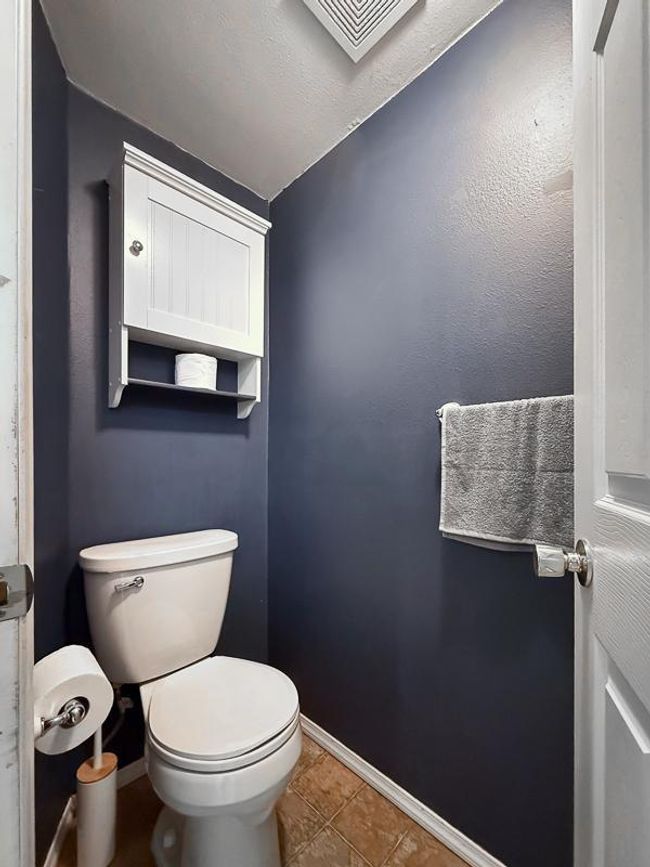 Half bathroom upon entry from attached garage - right next to laundry room | Image 26
