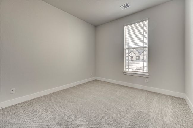 Empty room with visible vents, baseboards, and light colored carpet | Image 21