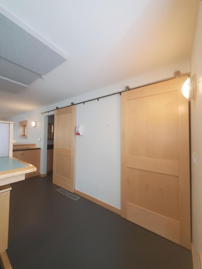 Upper level closet on right and bathroom on the left. | Image 27