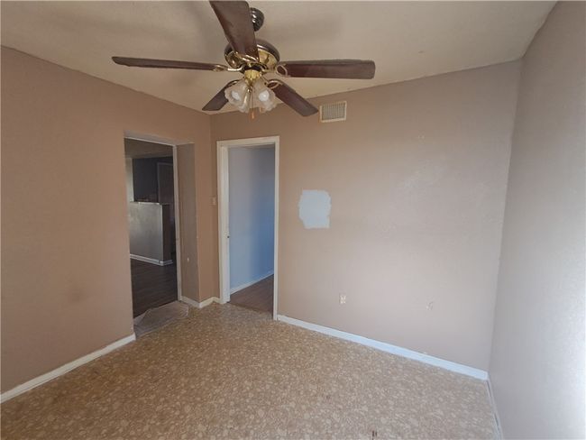 Spare room featuring a ceiling fan and baseboards | Image 22