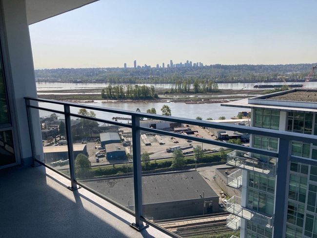 Balcony featuring a city view and a water view | Image 12