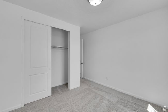 Unfurnished bedroom featuring carpet and a closet | Image 19