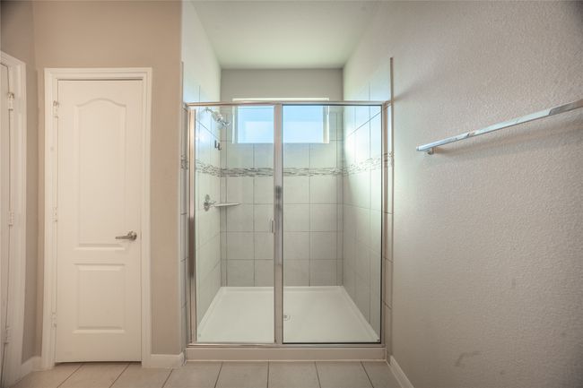 Bathroom with tile patterned floors and walk in shower | Image 18