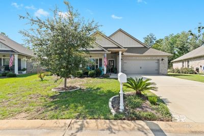 View of front of home with a garage and a front yard | Image 2