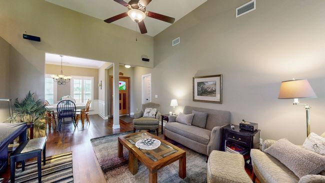 The dining room can be seen in this photo and is located right off of the kitchen for easy entertaining. | Image 6