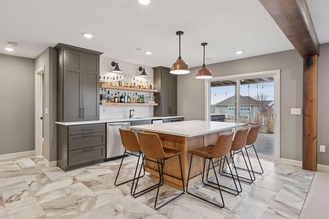 Unbelieveable bar set up + sliding door out to the patio | Image 32