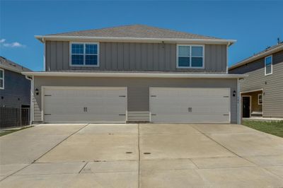 View of front of house with a garage | Image 1