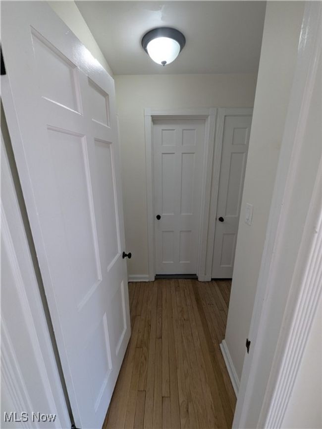 Hallway featuring baseboards and hardwood / wood-style flooring | Image 24