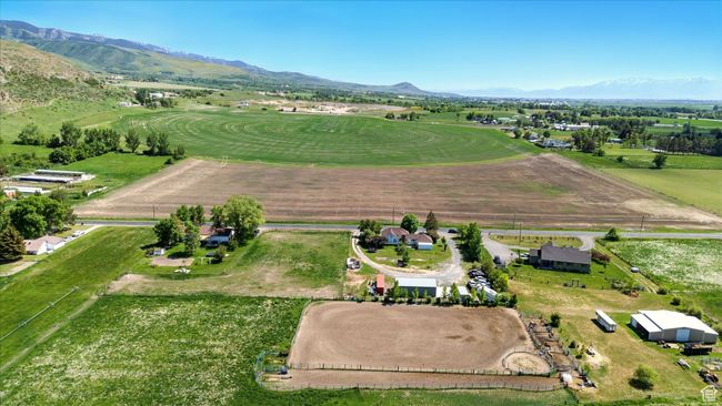 Aerial view of property and surrounding area featuring rural landscape and mountains | Image 31