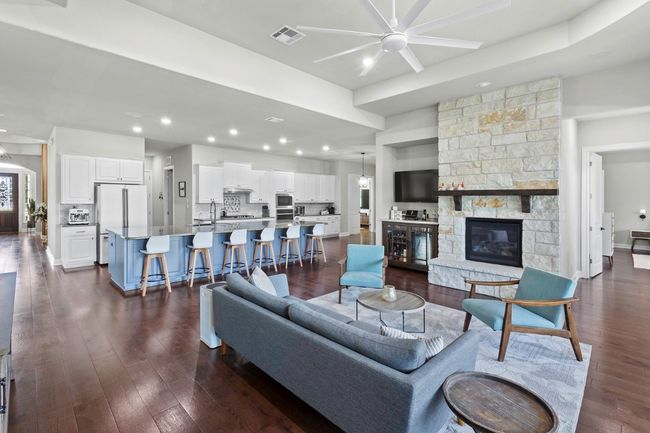 Living room featuring a gas fireplace | Image 16